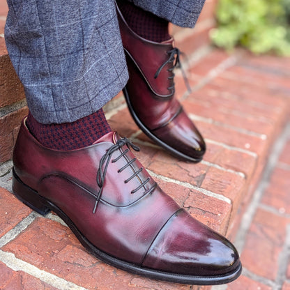 Michael Darren Houndstooth over the calf men's dress sock, Egyptian Cotton in Burgundy and Navy, worn on foot with Michael Darren Cap Toe in Black Cherry Patina