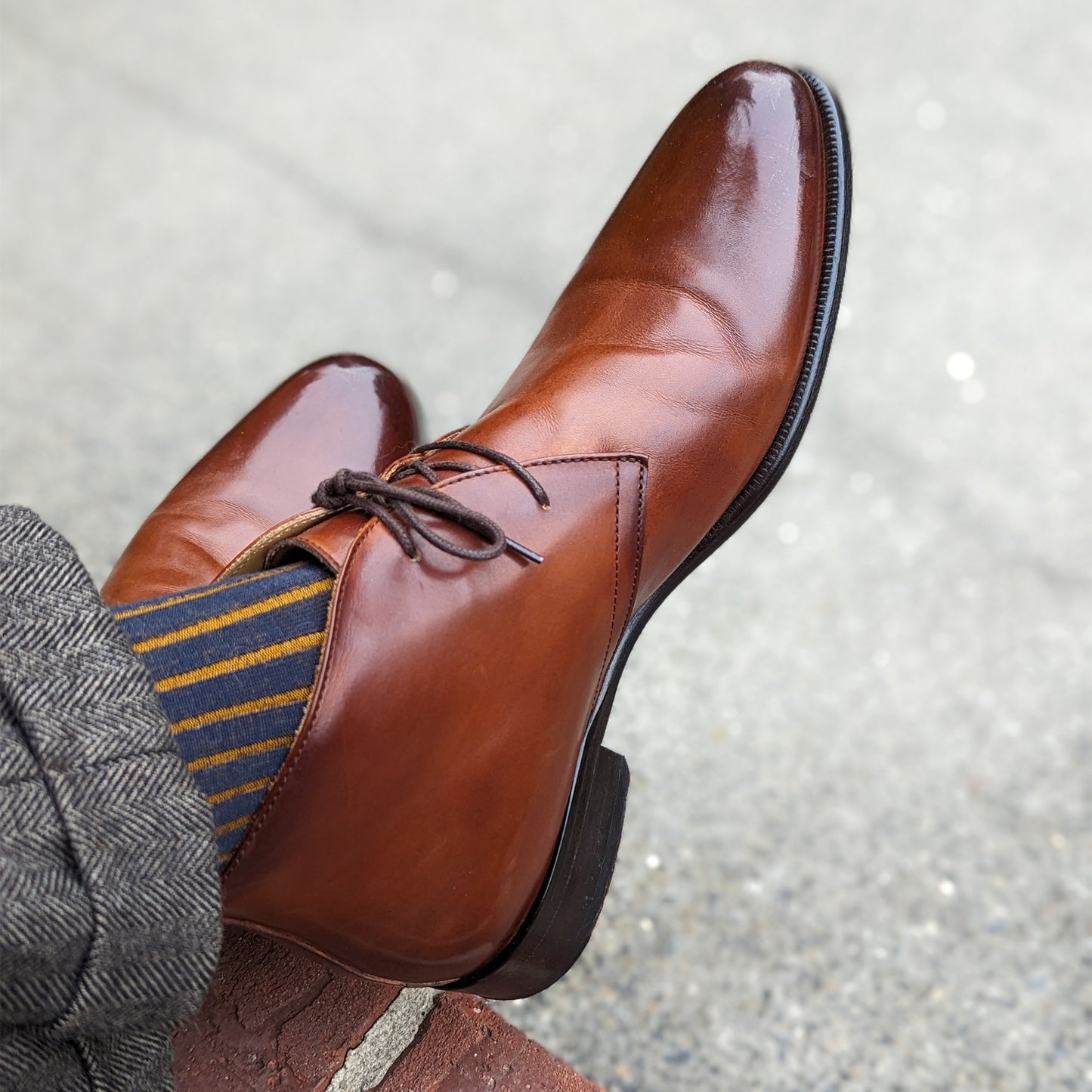 Michael Darren Shadow Stripe over the calf men's dress sock, Egyptian Cotton in Navy and Mustard, worn on foot with Michael Darren Chukka in Cognac Patina
